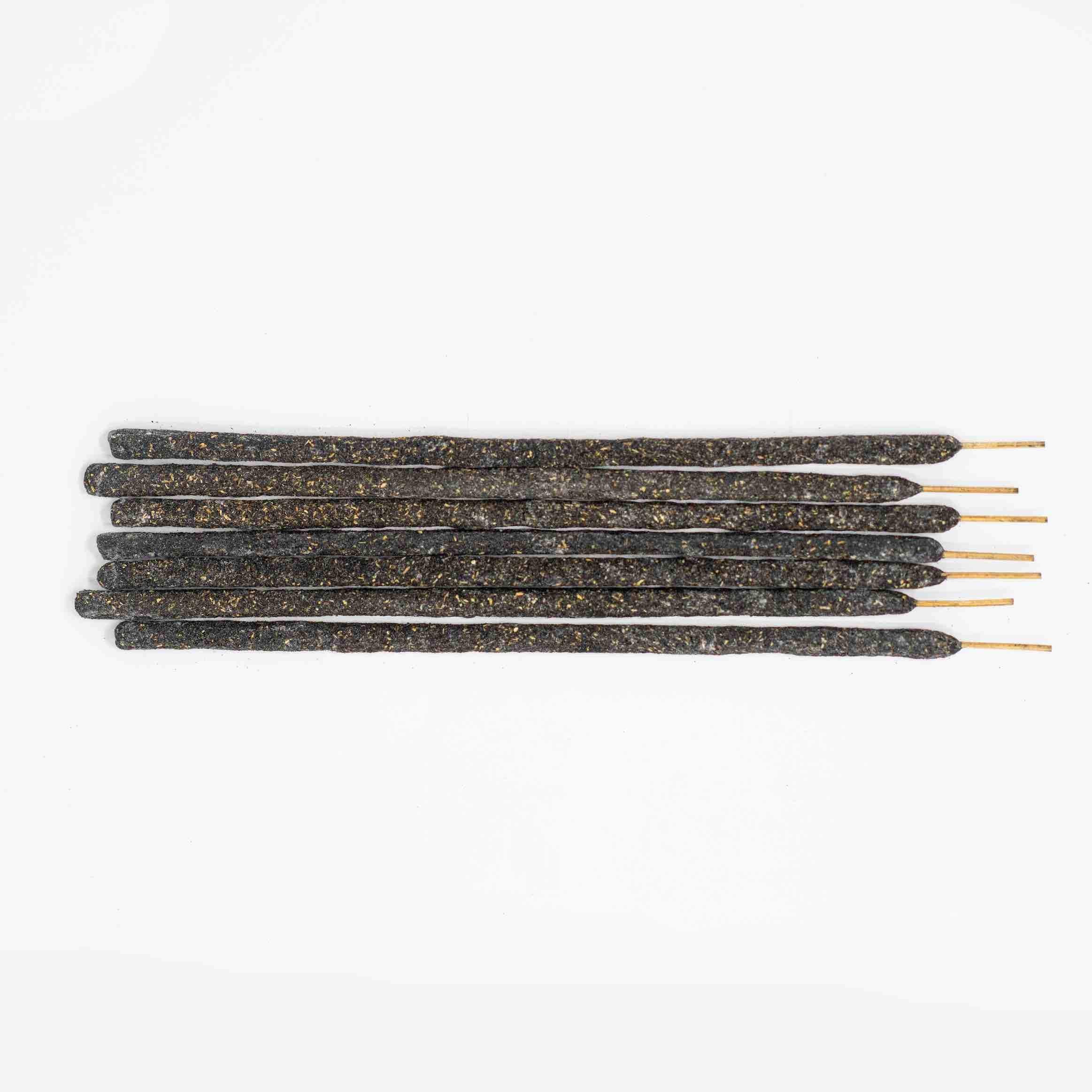 A pile of Wild Harvested Black Copal incense sticks